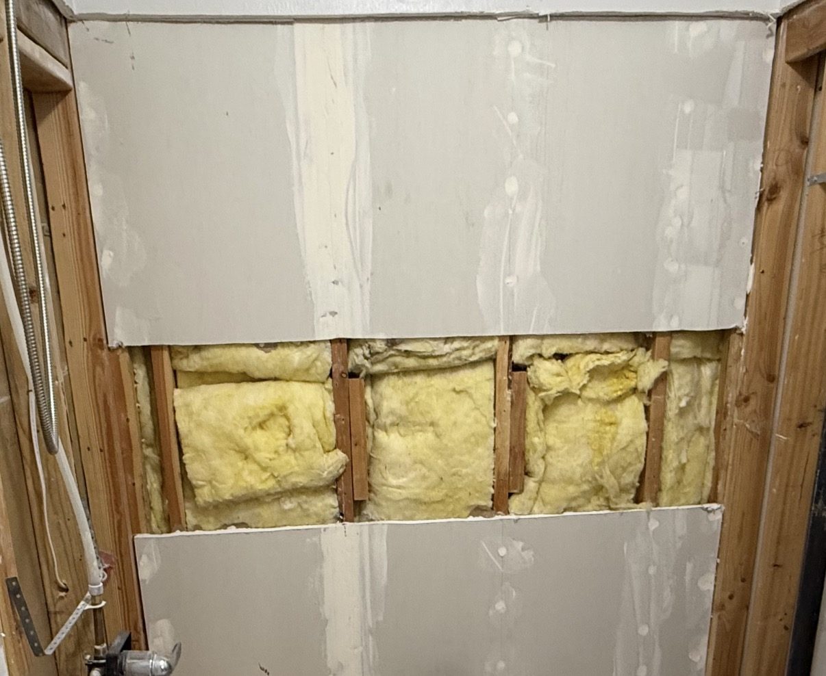 Insulated stud bays with solid blocking added between studs for a grab bar