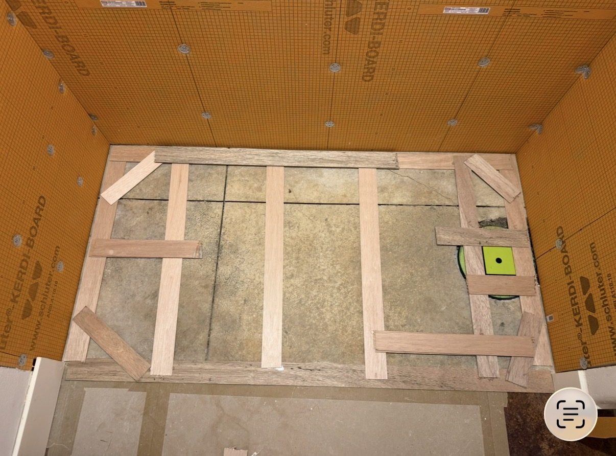 Wooden template of the shower base, seen from above