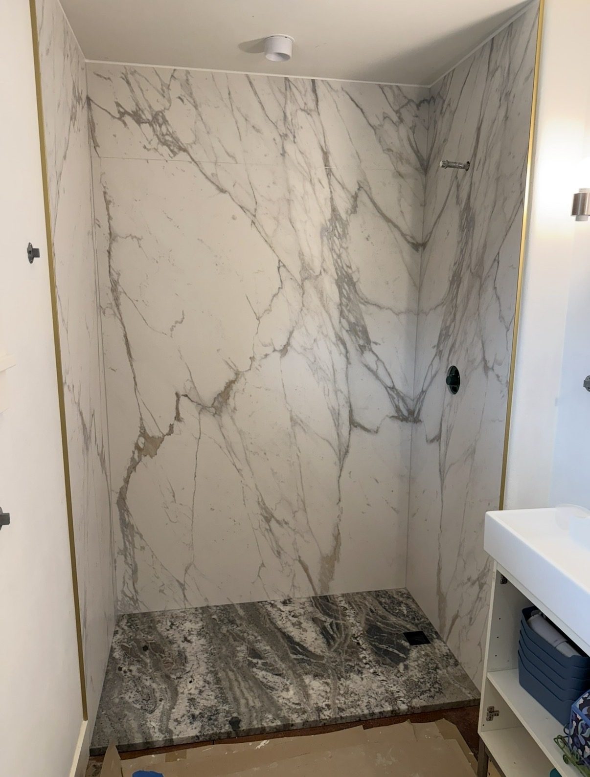 Stone walls and base installed before the glass went in