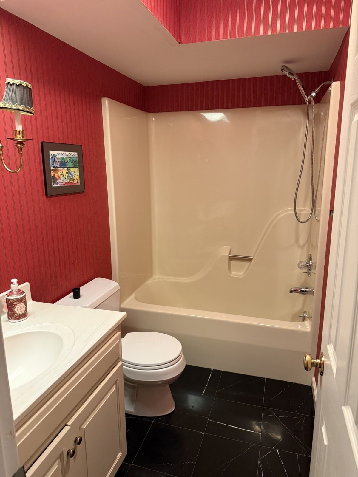 The original one-piece fiberglass tub and surround